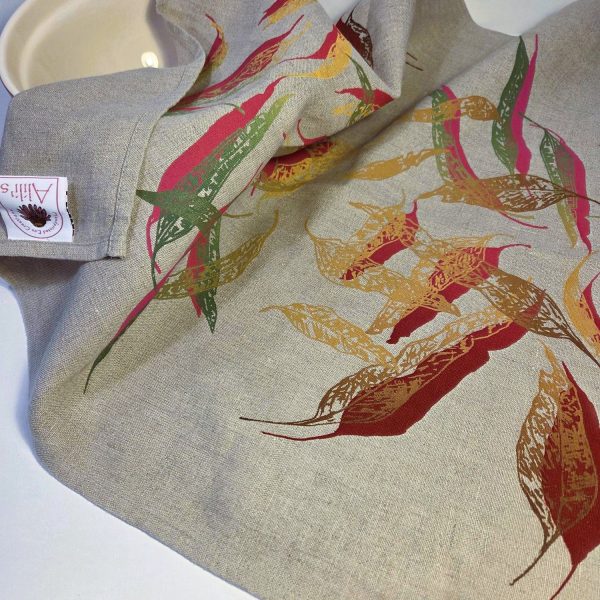 Linen tea towel featuring hand screen-printed eucalypt fallen leaves