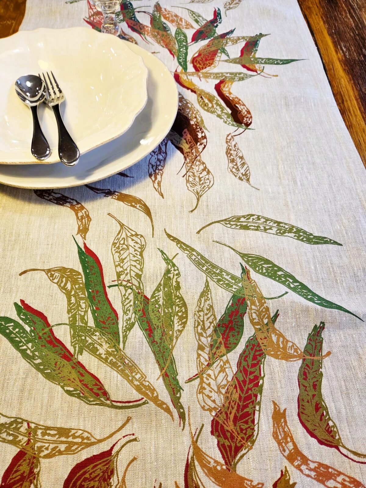 Hand screen-printed linen table runner with Australian Eucalypt Fallen Leaves design