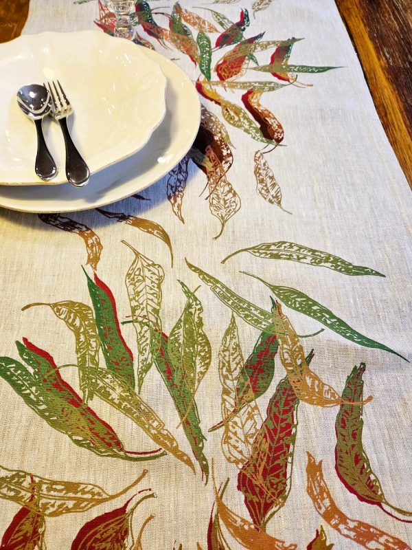 Hand screen-printed linen table runner with Australian Eucalypt Fallen Leaves design