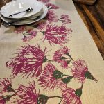 Detail of Australian eucalypt blossoms design on hand screen-printed linen table runner