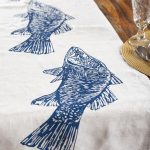 Hand screen-printed linen table runner with Australian barramundi design