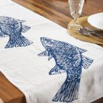 Detail of Australian barramundi design on hand screen-printed linen table runner